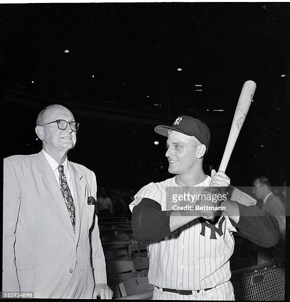 New York, NY: Ty Cobb, one of baseball's all-time batting greats, gets together with New York Yankee's Roger Maris before the Yanks faced the...
