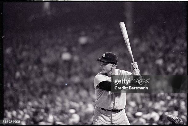 Baltimore, MD: Roger Maris of the New York Yankees lashes a single to short in the third inning of the second game of a twi-night doubleheader....