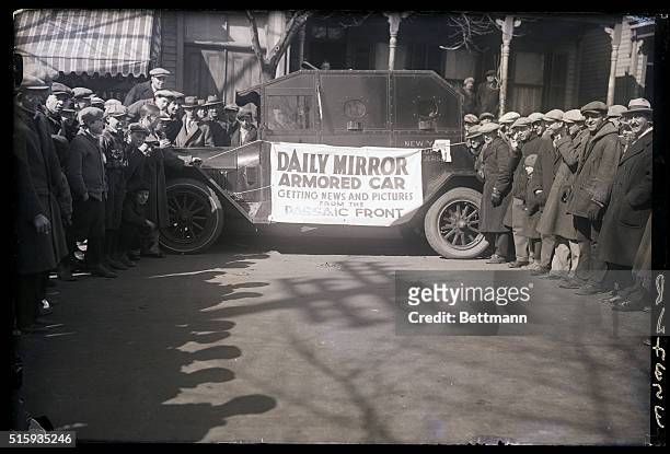Photo shows the armored car used by Daily Mirror photographers and reporters to cover the story of police cossackism to both newsmen and strikers in...