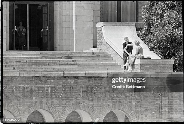 Little Rock, AR- Two students talk peacefully on the steps of Central High School at the noon hour of September 5. This scene is in sharp contrast to...