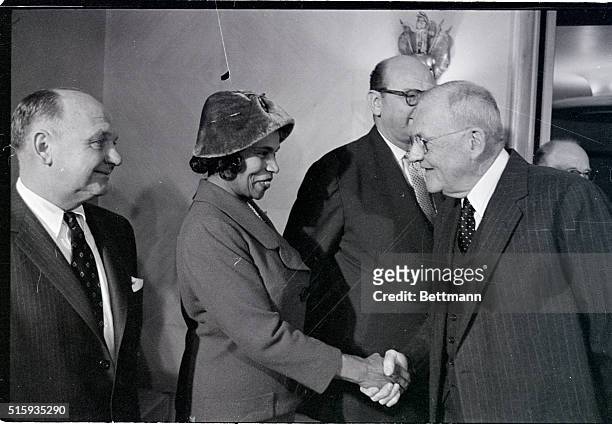 Washington, D.C.- Secretary of State John Foster Dulles congratulates Negro singer Marian Anderson after she and six other members of the U.S....