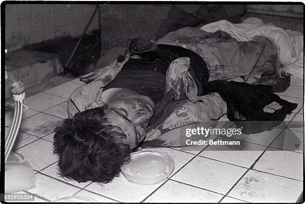 On Kurdistan Front, Iran- The bloodied body of a Kurdish rebel lies on the floor of a tiled room, awaiting burial, as fighting between Kurdish...