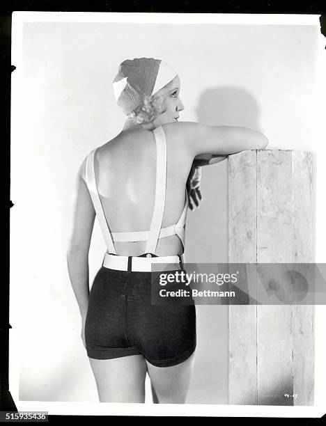 Here's a proper sunlight suit -- particularly on this girl, Claudia Dell, featured in RKO Radio Pictures and former follies favorite. It's red, black...