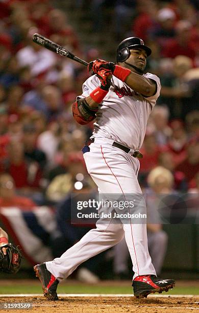 David Ortiz of the Boston Red Sox hits a double on a line drive to right fielder Larry Walker of the St. Louis Cardinals during the third inning of...
