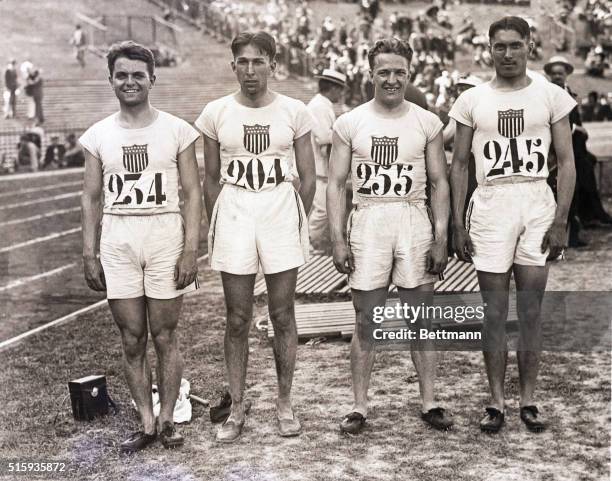 Paris, France- Members of the American 400-meter relay team, which established a new world record of 41 1/5 seconds for the event, pose at Colombes...