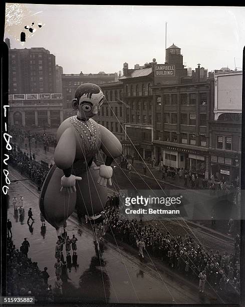 New York, New York: This gigantic figure of Eddie Cantor, featured in the annual Macy parade which every year brings joy to the kiddies of New York....