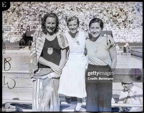 Los Angeles, CA- Winners of the 100-meter free style swim event for women are seen here after the trials in the Los Angeles Olympic swimming stadium....