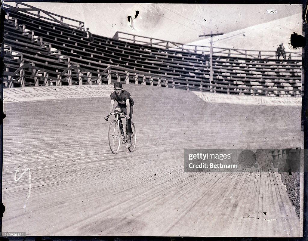 Bicyclist Riding Bike on Track