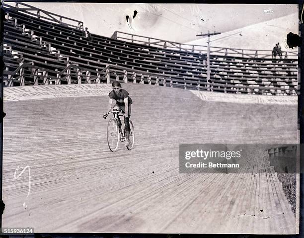 Martin, a bike rider form St. Louis, MO, is shown riding on a race track in training.