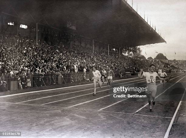 Paris, France- Alf Leconey of the U.S. Finishes the final 400 meter relay race, in which the American team broke its own world record of the previous...