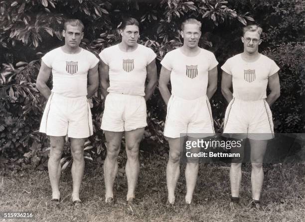 Colombes, France- Members of the decathlon team representing the United States at the Olympic Games pose just before one of the trial heats. Pictured...