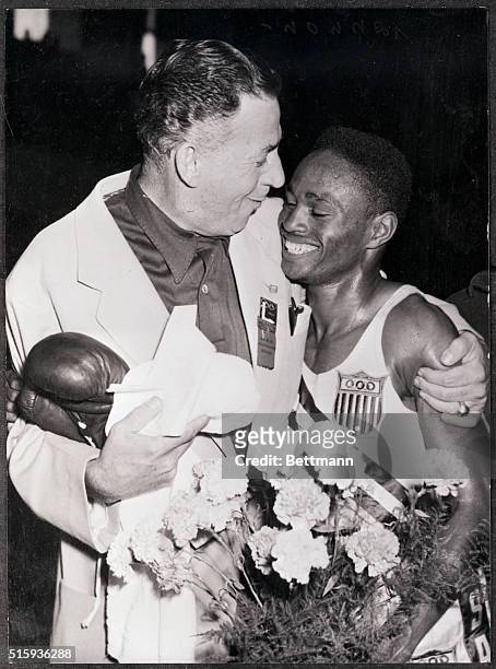 Helsinki, Finland- N. Brooks, US, is being congratulated after beating E. Basel, of Germany, in their fly-weight final bout at the Messuhalli,...