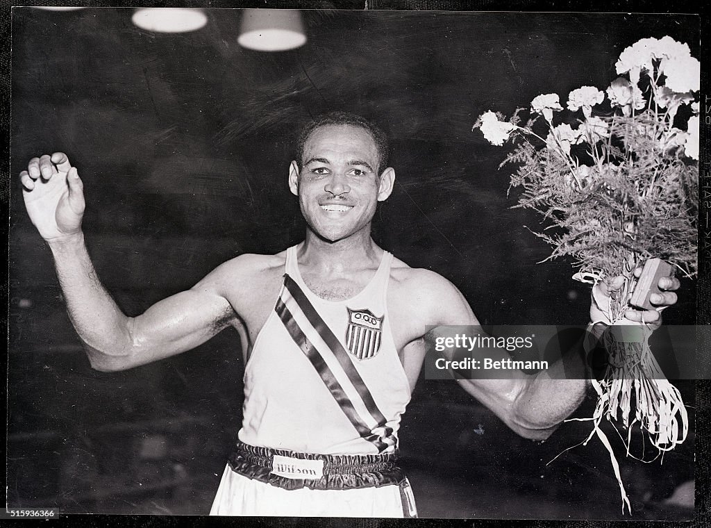 Olympic Boxer Holding Medal and Bouquet