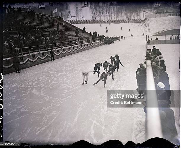 Lake Placid, NY: WINTER OLYMPICS. Photo shows skaters racing on the last lap in the 5,000 meter men's race, which was won by Irving Jaffee .