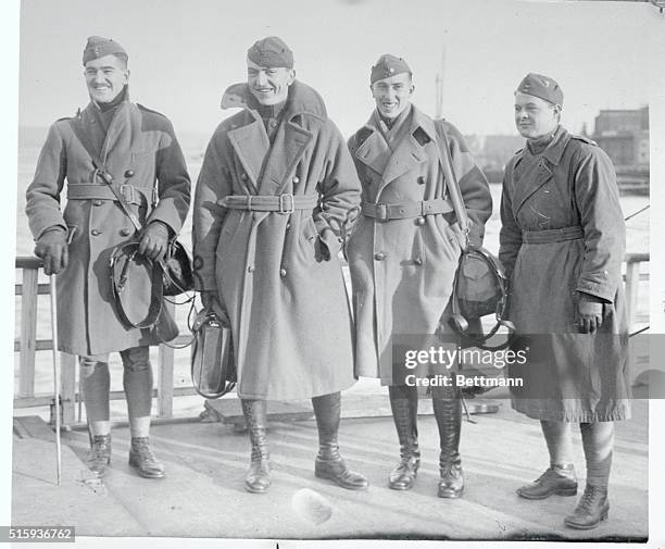 Four U. S. Aces are shown arriving on the S.S. Adriatic. Left to right are Lieutenant Douglas, Captain Eddie Rickenbaker, Major James A. Meissner,...