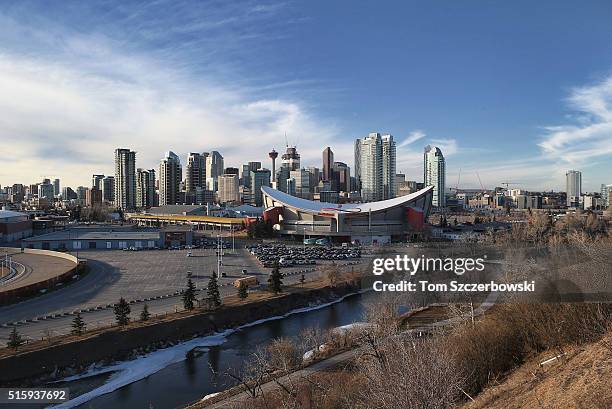 View of the exterior of the Scotiabank Saddledome home of the NHLâs Calgary Flames with the city skyline in the background on February 25, 2016 in...