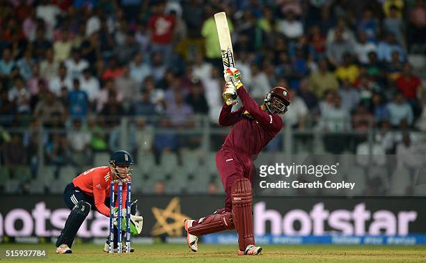 Chris Gayle of the West Indies hits out for six runs during the ICC World Twenty20 India 2016 Super 10s Group 1 match between West Indies and England...