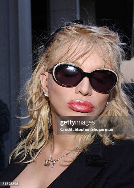 Musician Courtney Love meets with the media outside the Clara Shortridge Foltz Criminal Justice Center October 27, 2004 in Los Angeles, California....