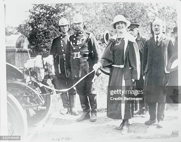 They christen fire engines with champagne in England...The Princess Alice of Athlone, christening one of the new fire engines at Windsor-Eton. And...