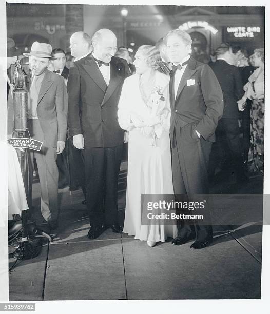 Cecil B. Demille, Mary Pickford, and Sid Grauman are seen here as they attended the premiere of Rain in Grauman's Chinese Theatre, Hollywood,...