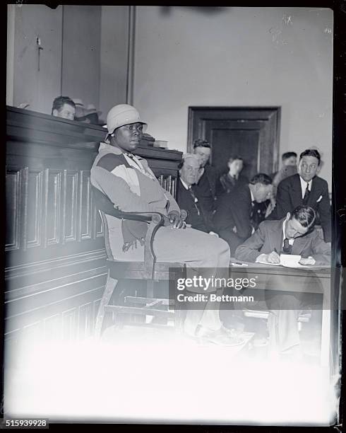 Beatrice Maddox, sister of Andy and Roy Wright, two of the seven defendants who will be tried later. Is seen here on the witness stand, as she...