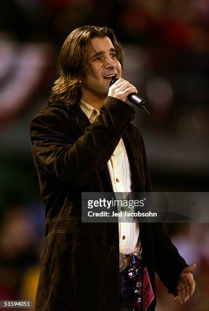 Scott Stapp of Creed sings "God Bless America" during the seventh inning stretch of game four of the World Series between the Boston Red Sox and the...