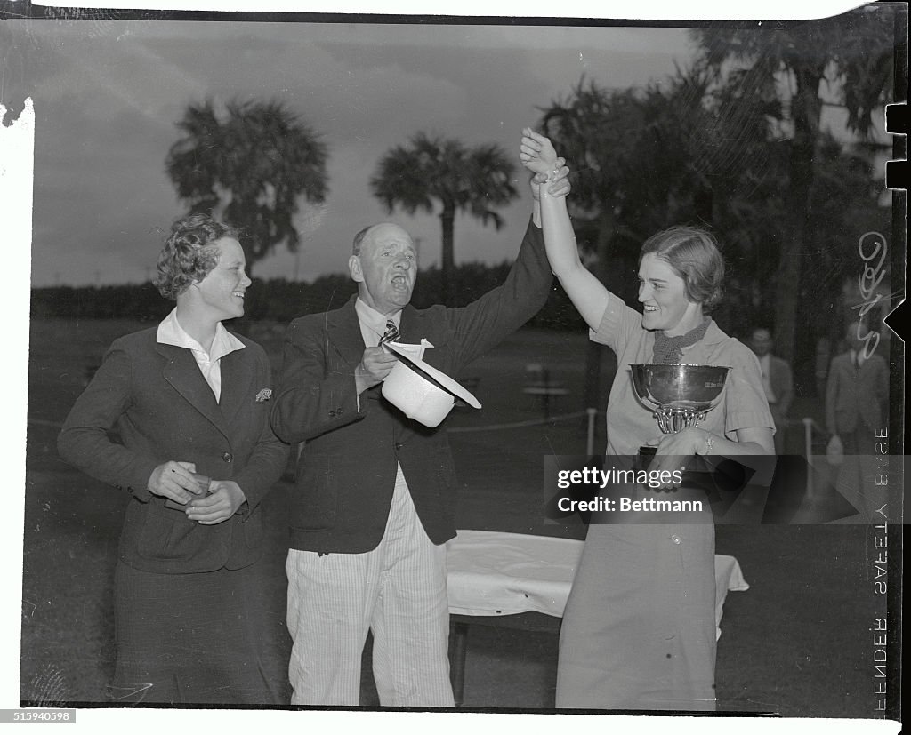 Man Raising Patty Berg's Hand