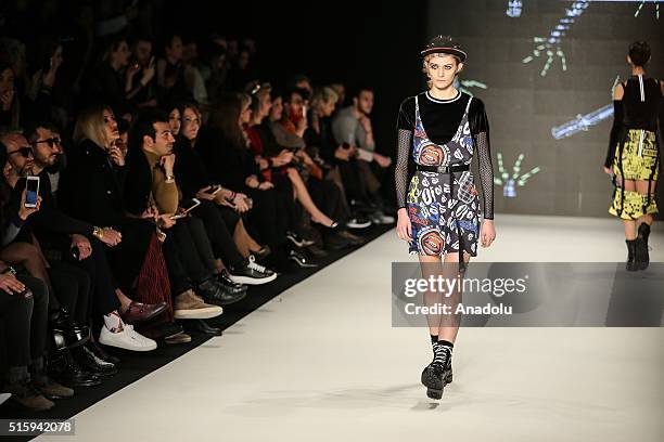 Model presents a creation by Deniz Berdan during the 2016/2017 Fall/Winter Mercedes-Benz Fashion Week at Zorlu Center MBFWI in Istanbul, Turkey, on...