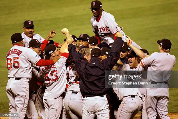 The Boston Red Sox celebrate after defeating the St. Louis Cardinals 3-0 to win game four of the World Series on October 27, 2004 at Busch Stadium in...