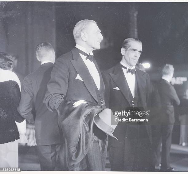 Boris Karloff and C. Aubrey Smith, English actors, are seen here on their arrival in the lobby of Grauman's Chinese Theater in Los Angeles for the...