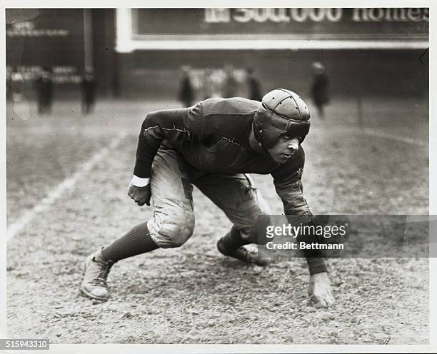 African American football captain, Donneghey, from Howard University, in position for a play.