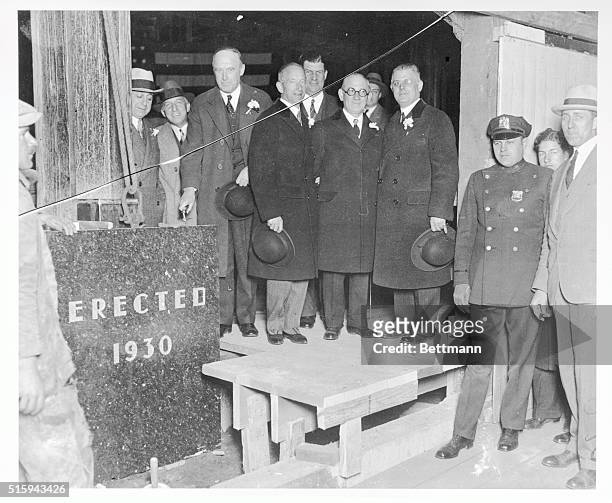 The cornerstone for the new Bloomingdale's building is shown here being laid. Left to right at the event are S. J. Bloomingdale, Hiram Bloomingdale,...