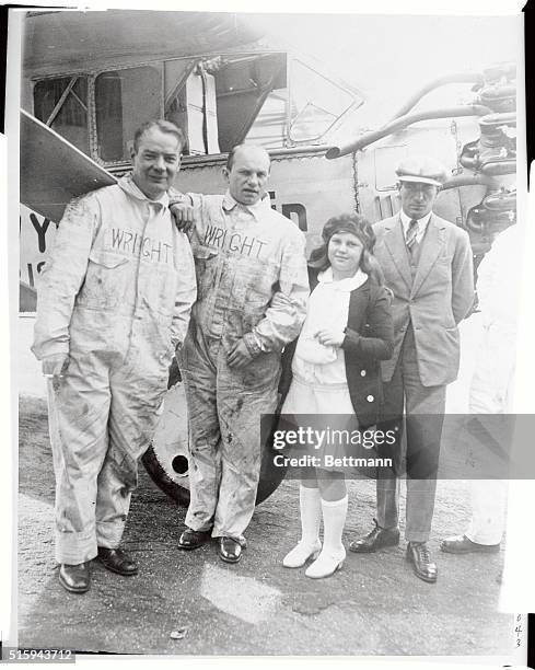 Left to right are Doc Kincaid, Wright motor expert; Charles A. Levine of New York, his daughter Eloyse and pilot Maurice Drouhin as they appeared at...