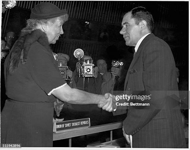 Eleanor Roosevelt, US representative to the United Nations is greeted by Soviet delegate Andrei Gromyko, Russian Ambassador to Great Britain, as they...