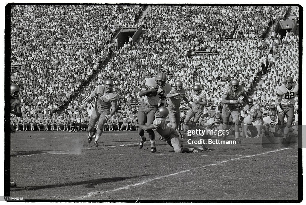 Bruin Tackling Syracuse Players