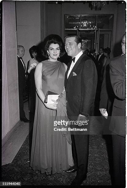 Singer Gordon MacRae with his wife, Elizabeth, at the "April in Paris" ball at the Waldorf-Astoria. Photograph, .