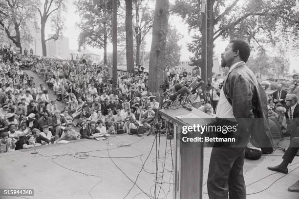 Washington, DC: Eldridge Cleaver speaking at American University at podium. SEE NOTE