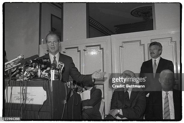 Treasury Secretary James Baker gestures to Federal Reserve chairman Paul Volcker and West German Finance Minister Gerhard Stoltenbert , at a press...