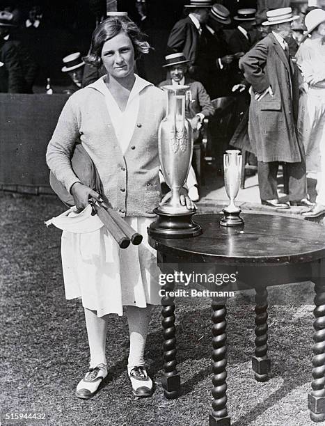Helen Jacobs stands with her trophy after defeating Alice Francis to win the Girls' National Singles Tennis Championship at the Philadelphia Cricket...