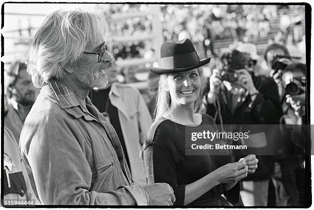 Bo and John Derek walk by photographers in Las Vegas, on April 6, 1987. The actress and her director husband attended the fight between Sugar Ray...