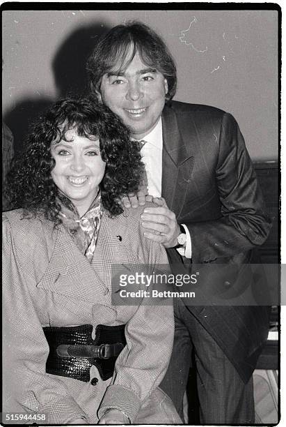 Musical composer Andrew Lloyd Webber leans against his wife Sarah Brightman on the first day rehearsals of "Phantom of the Opera". Webber wrote the...