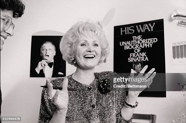 Kitty Kelly smiles at a book signing session for her new unauthorized biography of Frank Sinatra, titled His Way.