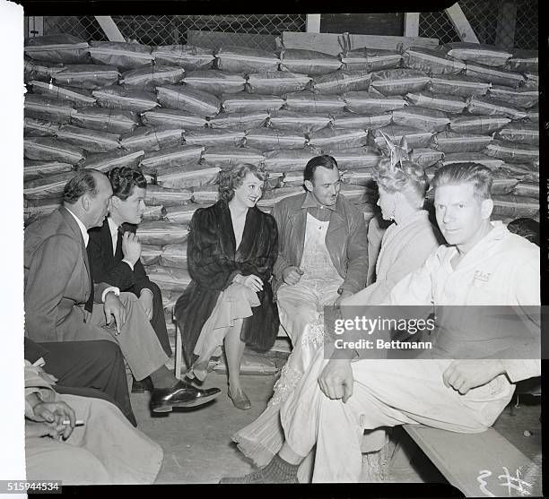 Hollywood, California: Director Michael Curtiz, actor Dennis Morgan, actress Bette Davis, a studio workman, actress Irene Manning are pictured as...