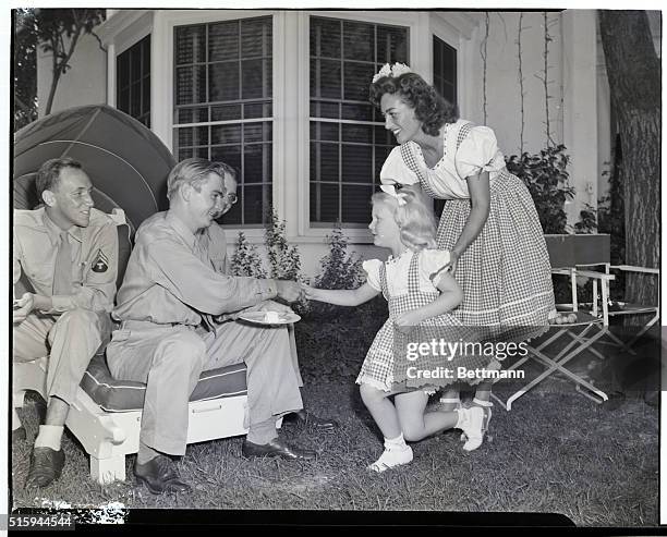 Brentwood, California: At her home in Brentwood, California, charming movie actress Joan Crawford introduces her adopted daughter, Christina to...