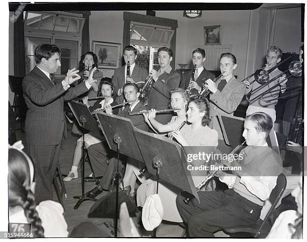 Conductor of the New York Philharmonic, John Barbirolli conducts the California Junior Symphony Association Orchestra.