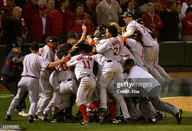 The Boston Red Sox celebrate after defeating the St. Louis Cardinals 3-0 to win game four of the World Series on October 27, 2004 at Busch Stadium in...