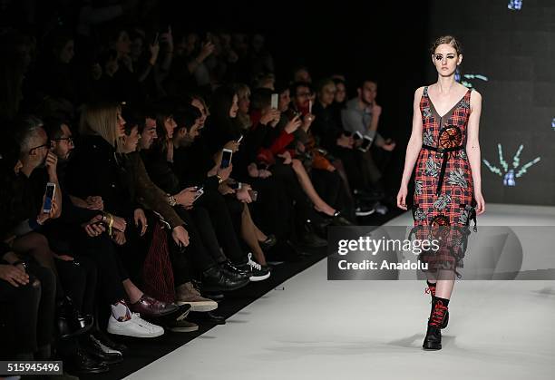 Model presents a creation by Deniz Berdan during the 2016/2017 Fall/Winter Mercedes-Benz Fashion Week at Zorlu Center MBFWI in Istanbul, Turkey, on...