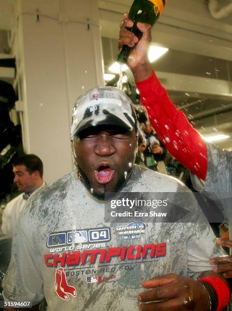 David Ortiz of the Boston Red Sox celebrates in the locker room after defeating the St. Louis Cardinals 3-0 to win game four of the World Series on...