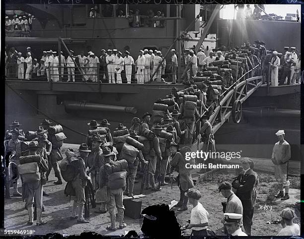 Philadelphia, PA: Marines boarding the U.S.C Conneticut at League Island Navy Yard, Philadelphia, July 31, when 500 of them sailed for...