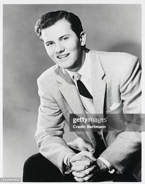 Pat Boone alone in 1957 file photo. Waist UP.